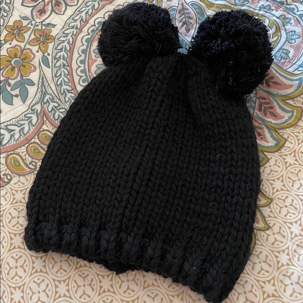 Black knit hat with double pom pom
